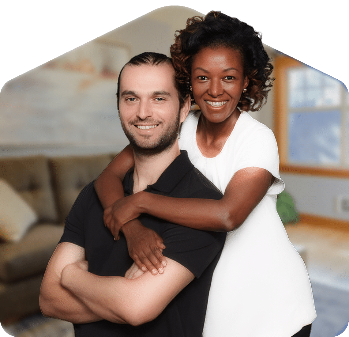 Couple embracing in cozy setting.