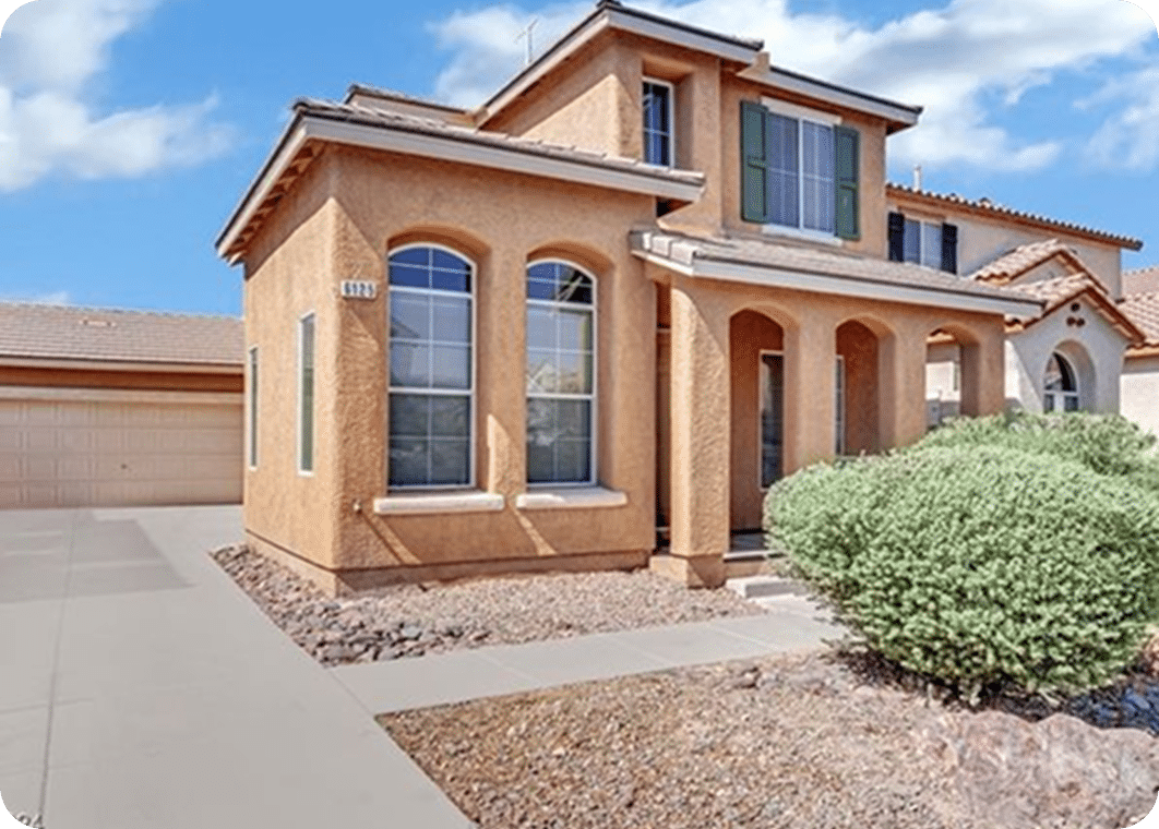 Modern house with desert landscaping.